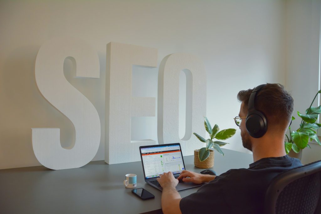 person working on a computer - Arise Digital Marketing